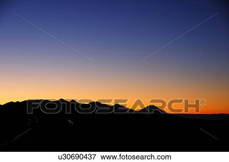 Stock Photo - Mt. Fuji Mountain Range Silhouette Dramatic Sky. Fotosearch