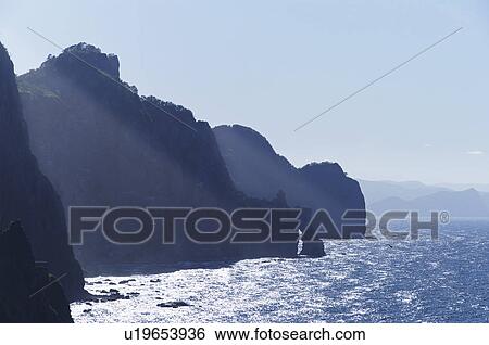 Stock Photograph - Omotai Coastline Rock Formation Sunlight Sea. Fotosearch