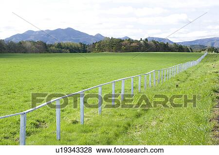Stock Photo - Pasture and Mountain Range. Fotosearch