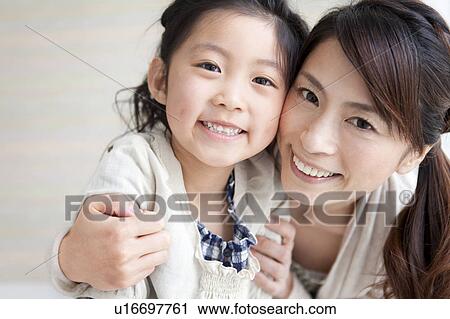 Stock Image - Portrait of mother and daughter. Fotosearch