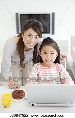 Stock Image - Portrait of mother and daughter. Fotosearch