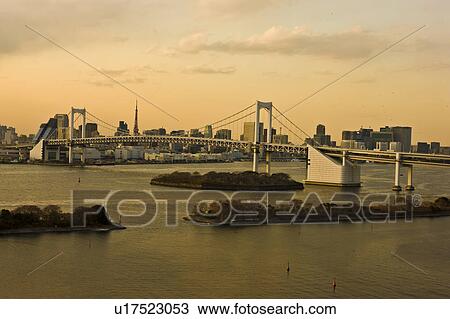 Stock Image - Rainbow Bridge and Tokyo Tower. Fotosearch