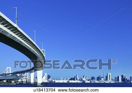 Picture - Rainbow Bridge Sea Skyline Waterfront Skyscraper. Fotosearch