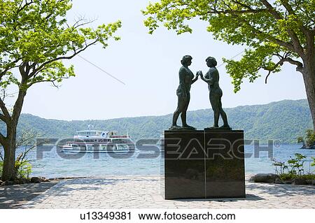 Stock Image - Sculpture Female Likeness Two Objects Lake Towada. Fotosearch