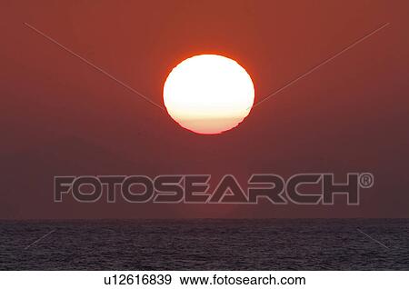 Stock Photo - Sea Horizon Over Water Sunrise Sun Dramatic Sky. Fotosearch