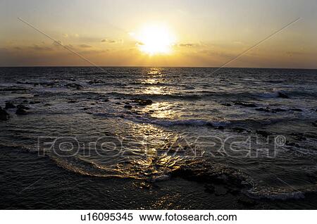 Stock Photography - Sea Horizon Over Water Sunset Sun Dramatic Sky. Fotosearch