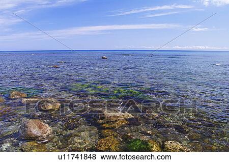 Stock Photo - Sea Rock Horizon Over Water Sky Cloud. Fotosearch