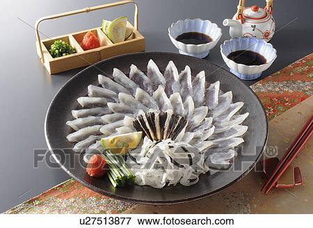 Stock Photo - Thinly Sliced Raw Blowfish. Fotosearch