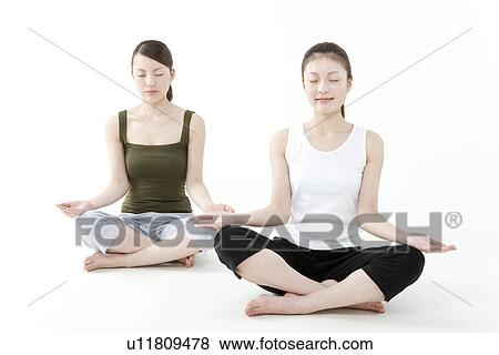 Stock Photo - Two People Meditating. Fotosearch