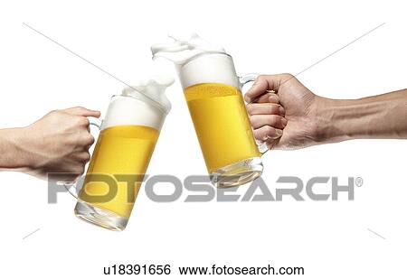 Stock Photograph - Two People Toasting with Beer. Fotosearch
