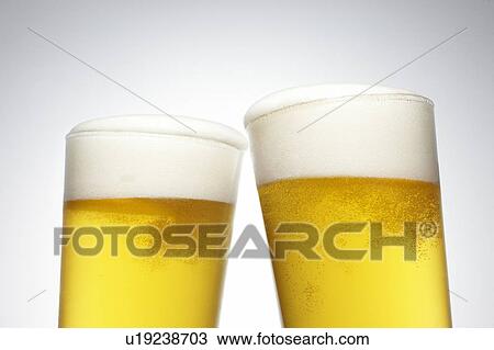 Stock Image - Two Pints of Beer. Fotosearch