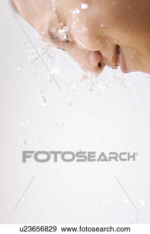 Stock Photo - Woman Washing Face Eyes Closed Water Clean. Fotosearch