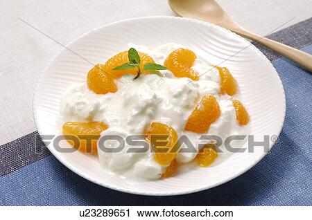 Yogurt and Mandarin Orange Pieces View Large Photo Image Stock Image - Yogurt and Mandarin Orange Pieces. Fotosearch