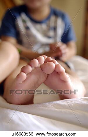 Young Boy's Barefeet on Bed View Large Photo Image Stock Image - Young Boy's Barefeet on Bed. Fotosearch