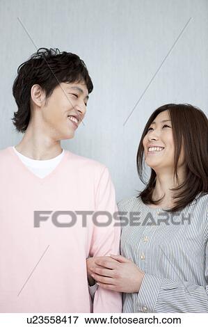 Stock Photo - Young couple smiling. Fotosearch