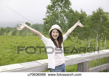 Young Woman Enjoying Countryside View Large Photo Image Stock Photograph - Young Woman Enjoying Countryside. Fotosearch