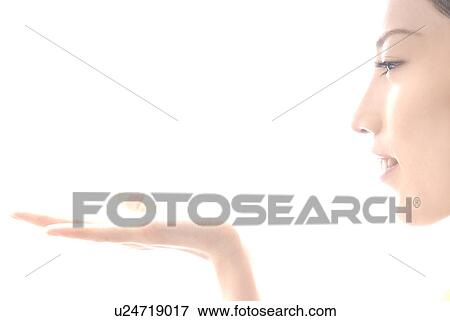 Young Woman Holding Object in Her Hand View Large Photo Image Stock Photo - Young Woman Holding Object in Her Hand. Fotosearch