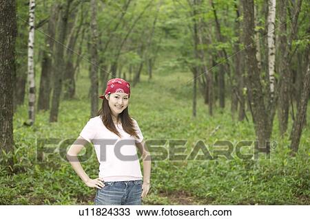 Young Woman in Forest View Large Photo Image Stock Image - Young Woman in Forest. Fotosearch