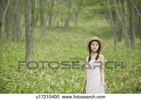 Stock Image - Young Woman In Forest. Fotosearch