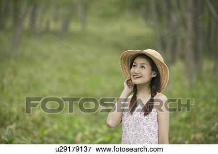 Stock Photo - Young Woman In Forest. Fotosearch