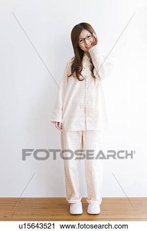 Young woman in pajamas View Large Photo Image Stock Image - Young woman in pajamas. Fotosearch