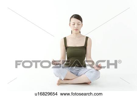 Picture - Young Woman Meditating. Fotosearch
