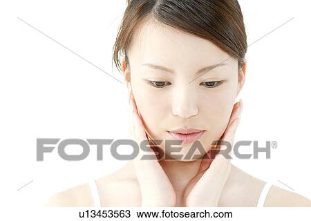 Young Woman Touching Her Face View Large Photo Image Stock Image - Young Woman Touching Her Face. Fotosearch