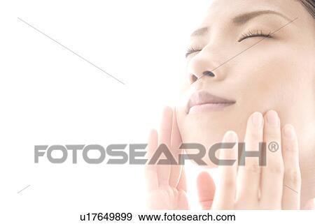 Young Woman Touching Her Face View Large Photo Image Stock Photo - Young Woman Touching Her Face. Fotosearch