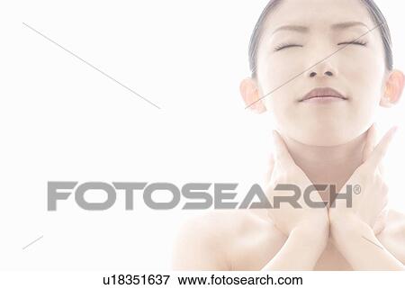 Stock Photo - Young Woman Touching Her Neck. Fotosearch