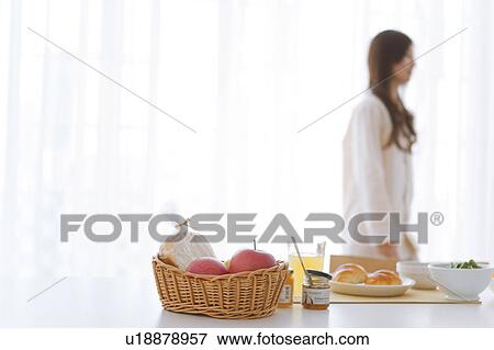 Young woman walking in pajamas and breakfast on table View Large Photo Image Stock Photo - Young woman walking in pajamas and breakfast on table. Fotosearch