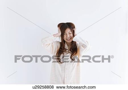 Young woman with head in hands View Large Photo Image Stock Photo - Young woman with head in hands. Fotosearch