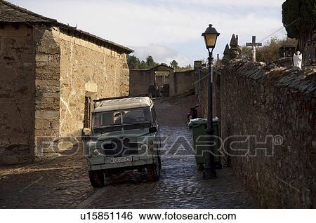 Stock Photograph - 4x4 Car Near Stone House. Fotosearch