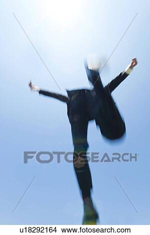 Picture - A businessman jumping. Fotosearch