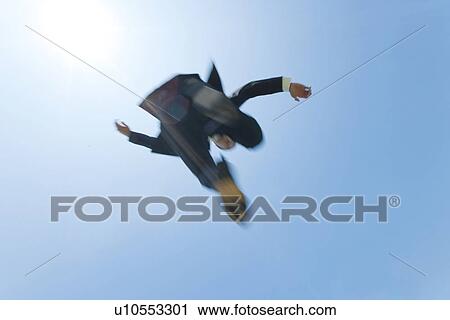 A businessman jumping View Large Photo Image Stock Image - A businessman jumping. Fotosearch