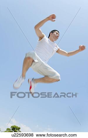 Stock Photo - An athlete jumping. Fotosearch