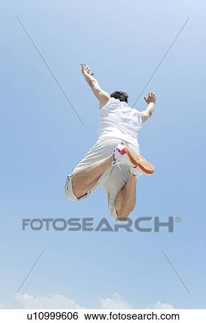 An athlete jumping View Large Photo Image Stock Photograph - An athlete jumping. Fotosearch