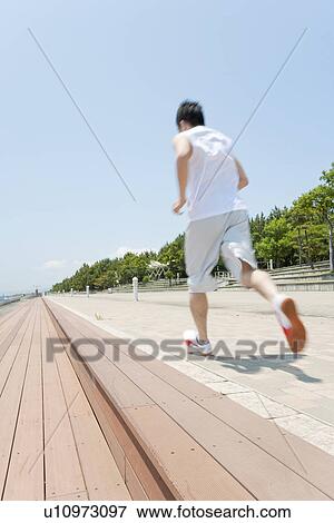 Stock Photo - An athlete running. Fotosearch