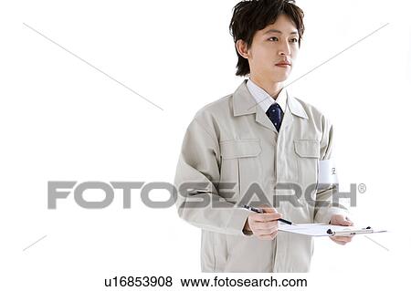 Stock Photo - Architect holding a clipboard. Fotosearch