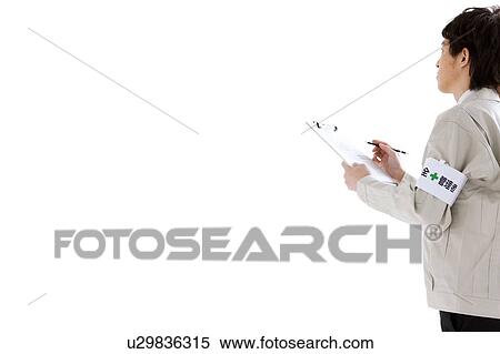 Stock Photography - Architect holding a clipboard. Fotosearch
