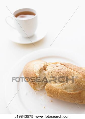 Stock Photography - Baguette and cup of tea. Fotosearch