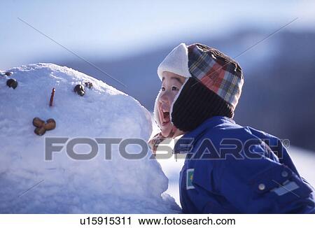 Boy and Snowman View Large Photo Image Stock Image - Boy and Snowman. Fotosearch