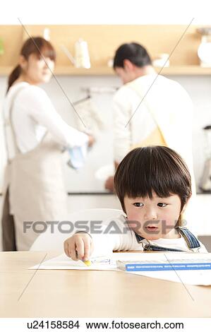 Boy drawing and parents washing dishes View Large Photo Image Picture - Boy drawing and parents washing dishes. Fotosearch