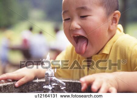 Boy Drinking From Fountain View Large Photo Image Stock Image - Boy Drinking From Fountain. Fotosearch