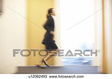 Stock Image - Business Woman Running. Fotosearch
