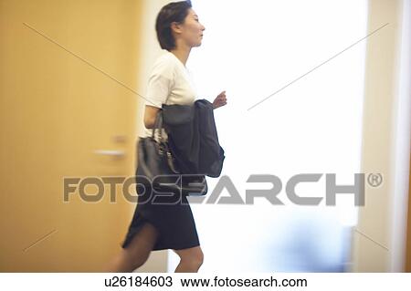 Stock Image - Business Woman Running. Fotosearch