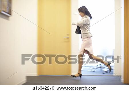 Stock Photograph - Business Woman Running. Fotosearch