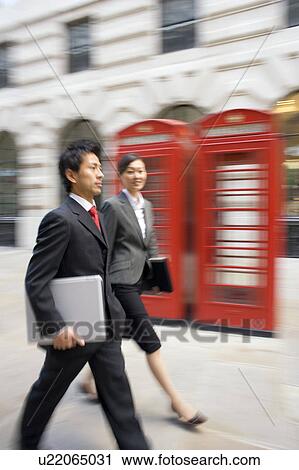 Businessman and Businesswoman Walking in London View Large Photo Image Stock Image - Businessman and Businesswoman Walking in London. Fotosearch