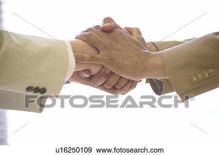 Businessman and woman shaking hands View Large Photo Image Stock Photo - Businessman and woman shaking hands. Fotosearch
