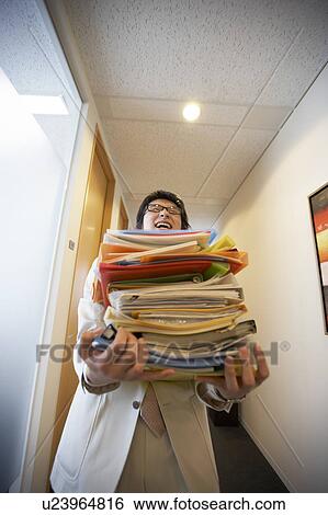 Businessman carrying files View Large Photo Image Stock Photograph - Businessman carrying files. Fotosearch