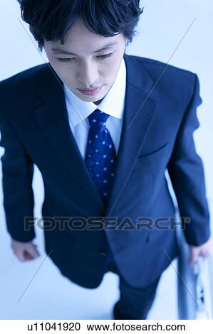 Stock Image - Businessman, high angle view. Fotosearch